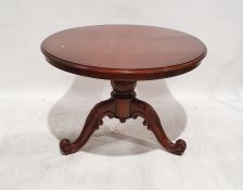 20th century centre table, the circular top with moulded edge, on turned and carved support to three