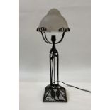 20th century lamp with frosted shade, on a wrought iron base with leaf decoration, 52cm high
