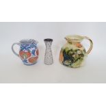 Andrew Hazeldon Aldermaston Pottery tin glazed earthenware jug with floral decoration, signed to