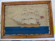19th century mariner's woolwork picture showing a three-masted schooner in full sail, ensign