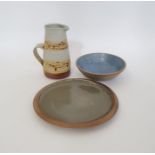 Mary Rich (b.1940 - 2022) a studio pottery jug with treacle glaze on oatmeal ground, impressed