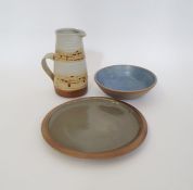 Mary Rich (b.1940 - 2022) a studio pottery jug with treacle glaze on oatmeal ground, impressed