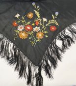 Black silk embroidered shawl lined in cream silk with deep embroidered fringe and floral design to