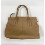 A Tod's caramel coloured leather bag, zip fastening, with side buckle marked 'Tod's', double