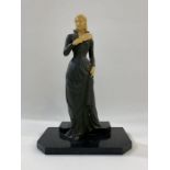 Early 20th century Art Deco-style figure of female form with fan, plastic head and hands, the