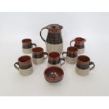 John & Judy Jelfs studio pottery stoneware coffee set with tenmoku glaze on oatmeal ground,