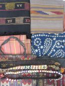 Assorted textiles , possibly Moroccan, to include embroidered, woven, belts, a kilim style soft bag,