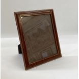 Asprey photograph frame , brown leather with gilt tooled decoration, glazed, to hold an 10 x 8"