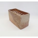 Sarah Walton (British, b.1945) a salt glazed flower brick, impressed "SW" mark to base (H. 12cm,