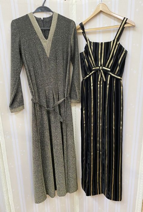 A 1970s black and gold lurex V-necked maxi dress with matching belt and a black cocktail dress
