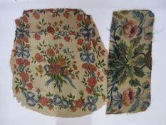 Two antique needlepoint tapestry chair covers with floral spray centrepiece surrounded by flowers,