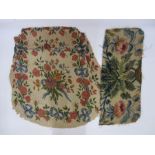 Two antique needlepoint tapestry chair covers with floral spray centrepiece surrounded by flowers,