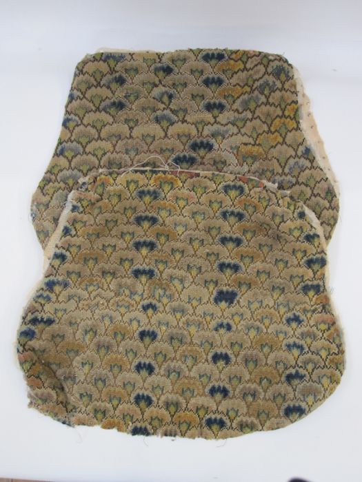 Two antique needlepoint chair covers with a recurring blue, green, yellow and brown fan-type pattern