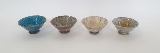 Four Raku fired bowls, indistinctly stamped to base. (4)