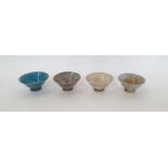 Four Raku fired bowls, indistinctly stamped to base. (4)