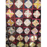 Hand-made brightly-coloured squared patchwork quilt (unsown edges) together with other fabric items,