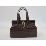 Vintage crocodile handbag with brass loop fitting, the fixed frame covered in leather, double
