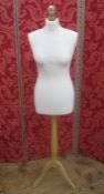 Dress maker's dummy on adjustable wooden stand