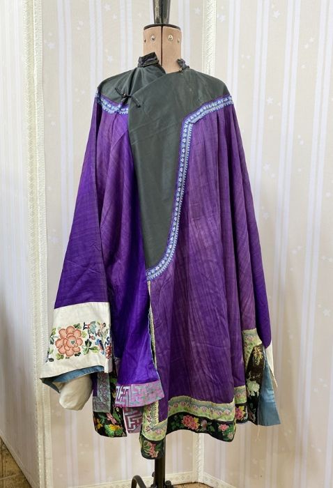 Antique Chinese robe in purple with a turquoise lining and dark green band, deep sleeves with