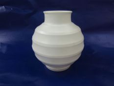 Keith Murray for Wedgwood, a Moonstone "football" vase, of globular form with concentric ribs,