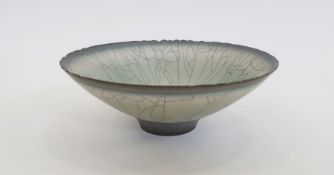 David White (1934 - 2011) a studio porcelain craquelle effect footed bowl with blue and green