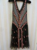French 1920's museum quality black net flapper dress,  embroidered with tiny beads in pink, red,