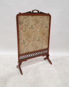 Late 19th/early 20th century needlework fire screen, the top with incorporated finial and acanthus