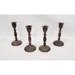 Set of four Victorian weighted candlesticks on turned stems, on circular bases, Sheffield 1894,