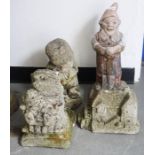 Four composite stone garden ornaments to include a gnome, a mill, a seated hedgehog and one