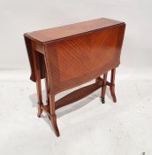 Edwardian satinwood Sutherland table with shaped top and ebony stringing on square-sectioned