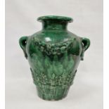 19th century French / Continental green glazed searthenware twin-handled pot with wreath and leaf