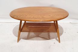 Ercol light elm-topped coffee table with beech magazine rack under, 44cm x 98cm x 83cm Condition