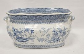 Large blue and white footbath with floral decoration, indistinctly marked to base, 21cm x 47cm x