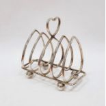 George V silver toast rack, heart-pattern with four sections, on ball feet, Birmingham 1930, 3ozt