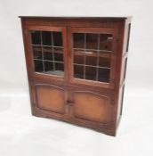 20th century oak cupboard, the rectangular top above two leaded glazed doors and two cupboard doors,