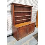 Late 19th century oak dresser, the top section with moulded cornice above three shelves and two