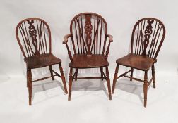 Set of six 20th century elm-seated wheel-back chairs with stretchered turned legsCondition
