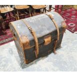 Domed top leather and canvas trunk with painted inscription to top ' G Jardine Nottingham' on wooden