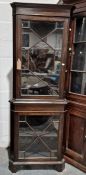 20th century corner display cabinet, the moulded cornice above astragal-glazed door enclosing