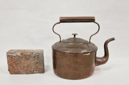 Possibly Victorian red clay brick with relief mask decoration together with a copper kettle (2)