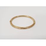 18 carat gold bangle  marked 750 14.0gCondition ReportSome light surface scratches/scuffs, no dents.