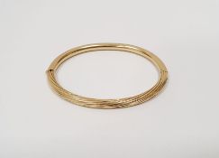 18 carat gold bangle  marked 750 14.0gCondition ReportSome light surface scratches/scuffs, no dents.