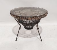 Mid-century modern circular coffee table, the glass top on wicker basket body and metal legs, 52cm x