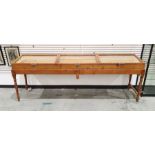 Pine three-section haberdashery counter-top cabinet with three separate glazed lift-top sections, on