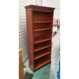 20th century mahogany open bookcase with moulded top above five shelves, on bracket feet, 190cm x