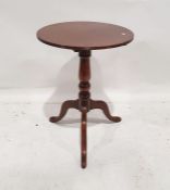 20th century mahogany tripod table, the circular top on turned supports, tripod base