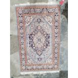 Blue ground rug with central floral medallion and herati design with floral border 155cm x 98cm