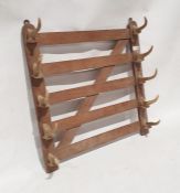 Oak wall-hanging whip rack by Swaine and Adeney