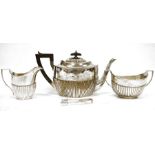 Early 20th century three-piece silver teaset comprising teapot, two-handled sugar bowl and milk jug,