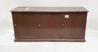 Vintage stained pine low three-door cupboard on plinth base, 82cm x 182cm x 55cm